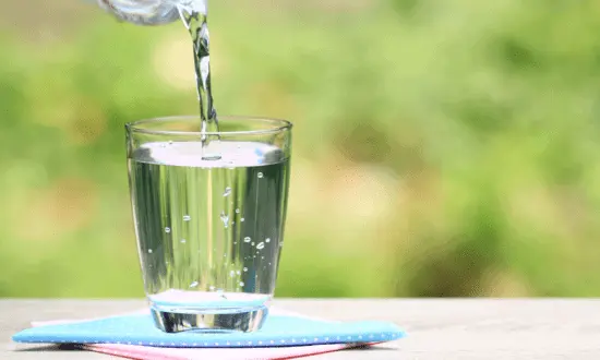 Pouring clean water in glass